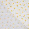 Tissu coton plumetis citrons - écru x 10 cm