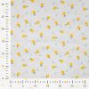 Tissu coton plumetis citrons - écru x 10 cm