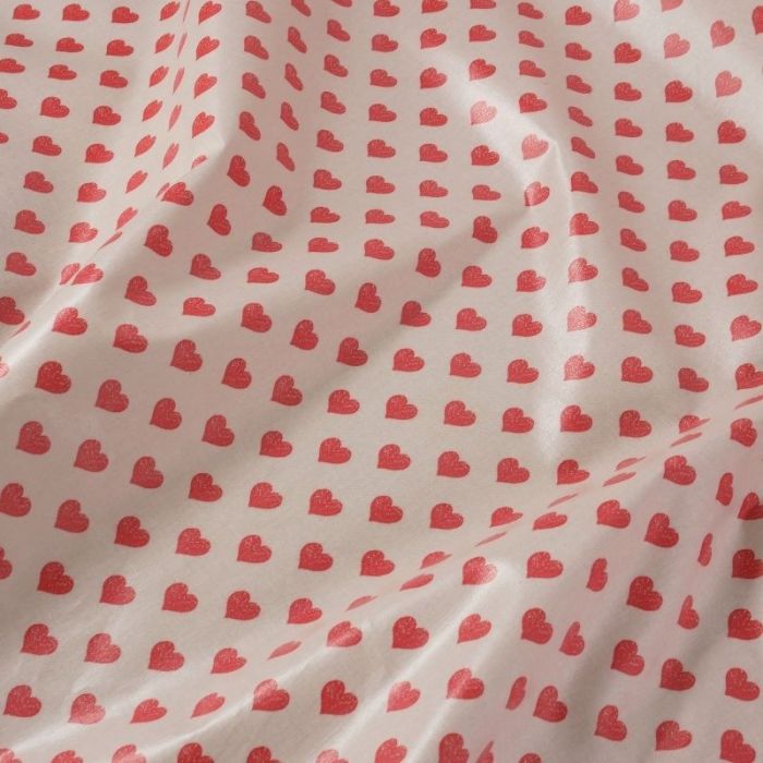 Tissu coton enduit coeurs rouges - rose clair x 10 cm