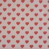 Tissu coton enduit coeurs rouges - rose clair x 10 cm