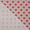 Tissu coton enduit coeurs rouges - rose clair x 10 cm